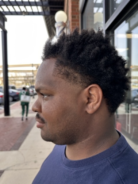 Client with textured crop haircut.