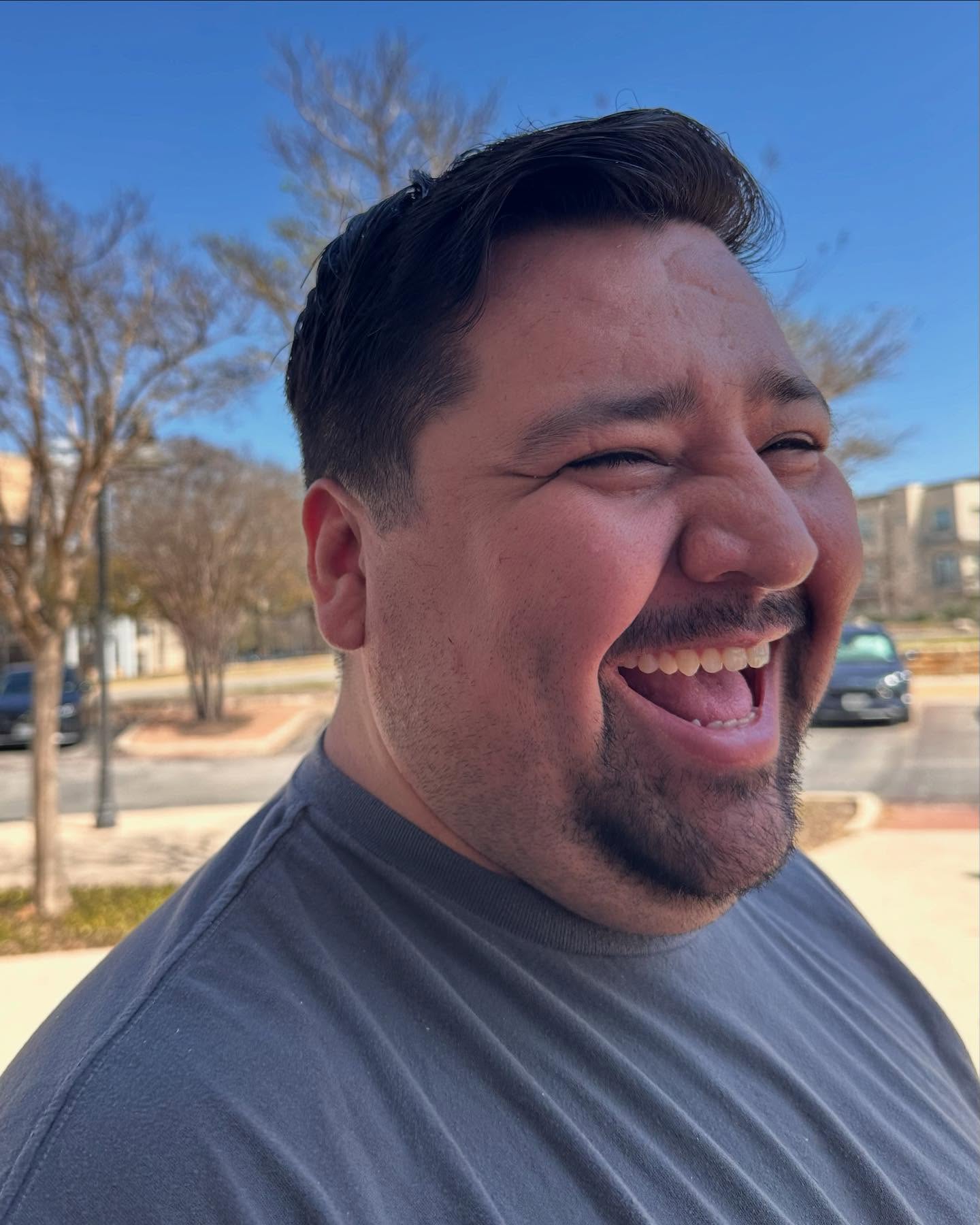 Happy man with a fresh fade haircut.